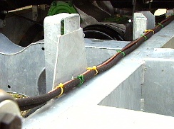 Right hand chassis member showing fuel and brake lines on top of chassis